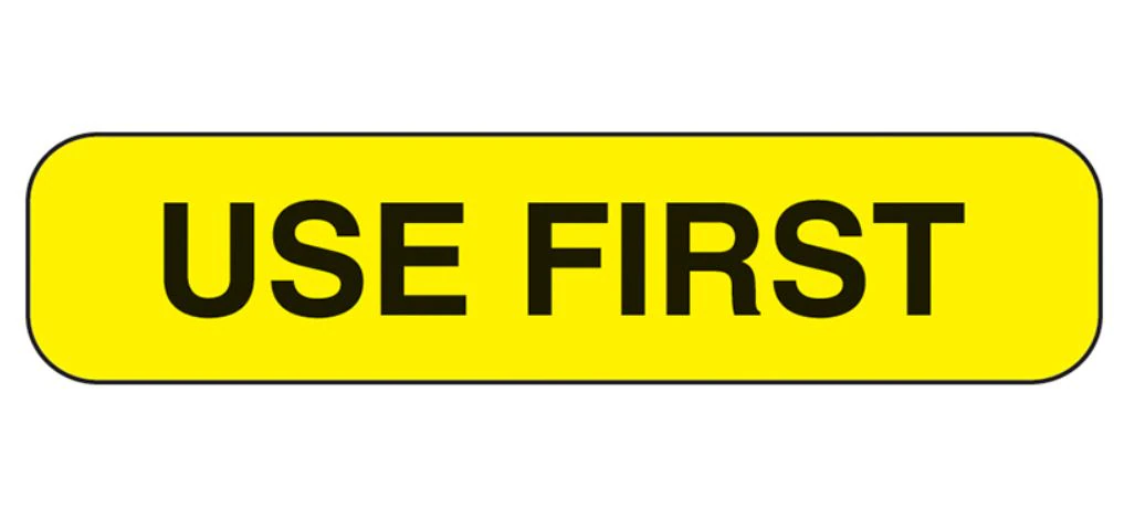 Health Care Logistics "Use First" Label, Yellow, 1-5/8 x 3/8 inch, Black Text, 1000/Box - Label "Use First" 1-5/8x3/8" - Image 1